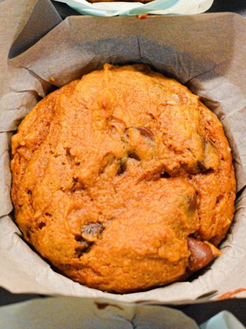 Pumpkin chocolate chip muffins made with a spice cake mix are easy to make with just four ingredients for a quick and easy fall treat.