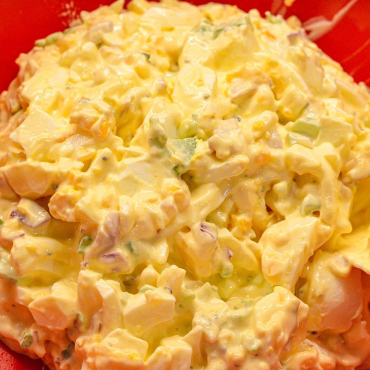 Stir the chopped eggs into the dressing. Now you have a creamy egg salad. Adjust the mayo, mustard, and seasonings to your taste.