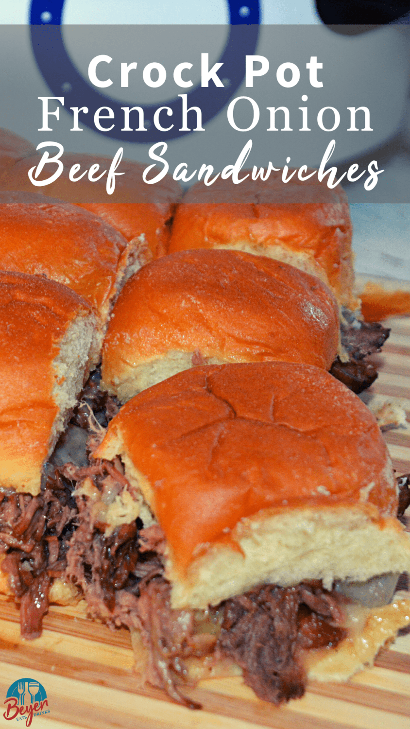 Crock Pot French onion beef sandwich recipe is a shredded French onion beef roast made with canned French onion soup, onions, butter and beef broth used to make cheesy sliders on Hawaiian rolls.
