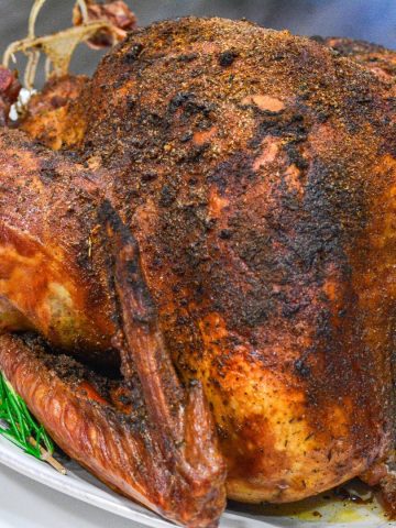 Smoked Turkey is a great alternative way to make the Thanksgiving turkey with a simple brine recipe and then 4 to 6 hours on the smoker.