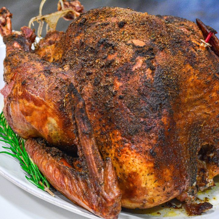 Smoked Turkey is a great alternative way to make the Thanksgiving turkey with a simple brine recipe and then 4 to 6 hours on the smoker.