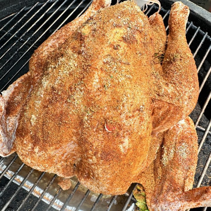 Place the turkey on the smoker rack, breast side up. Insert a meat thermometer into the thickest thigh area.