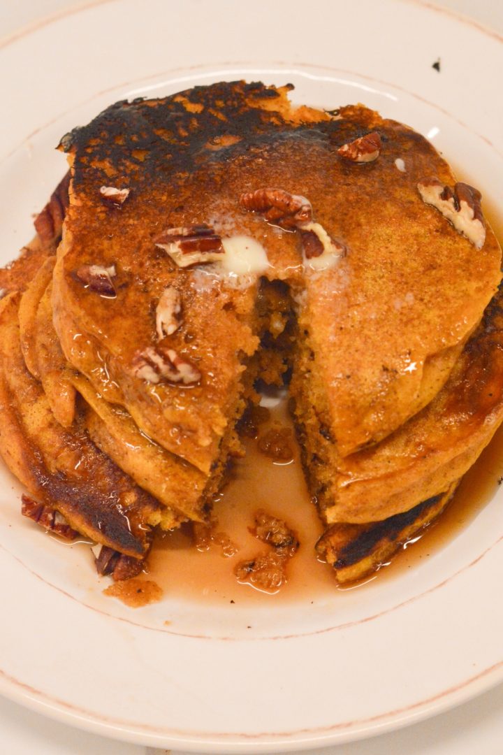 Pumpkin spice pancakes have real canned pumpkin in the batter and are easy to make with a store-bought pancake mix.