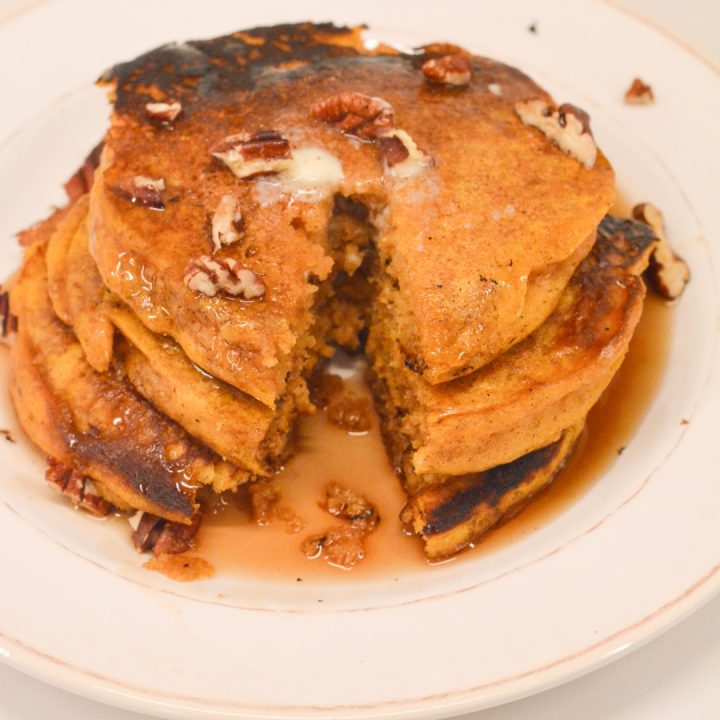 Pumpkin spice pancakes have real canned pumpkin in the batter and are easy to make with a store-bought pancake mix.