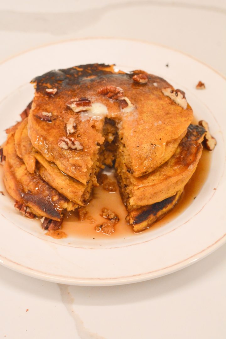 Pumpkin spice pancakes have real canned pumpkin in the batter and are easy to make with a store-bought pancake mix.