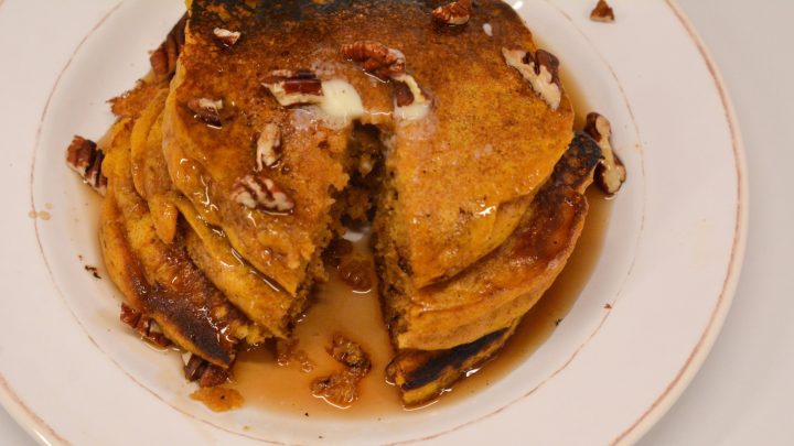 Pumpkin spice pancakes have real canned pumpkin in the batter and are easy to make with a store-bought pancake mix.