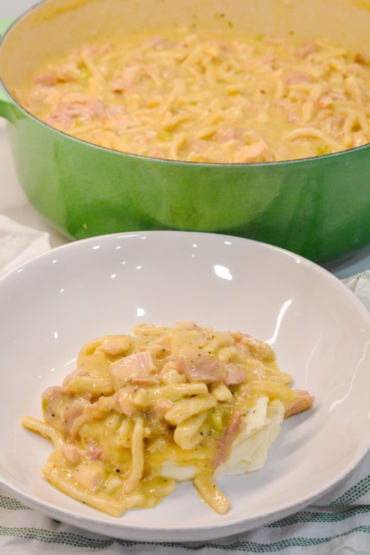 Turkey and Noodles made with leftover turkey is easily made on the stove by sauteing onoins, celery, and garlic together before adding the turkey, broth, and Reames wide noodles.