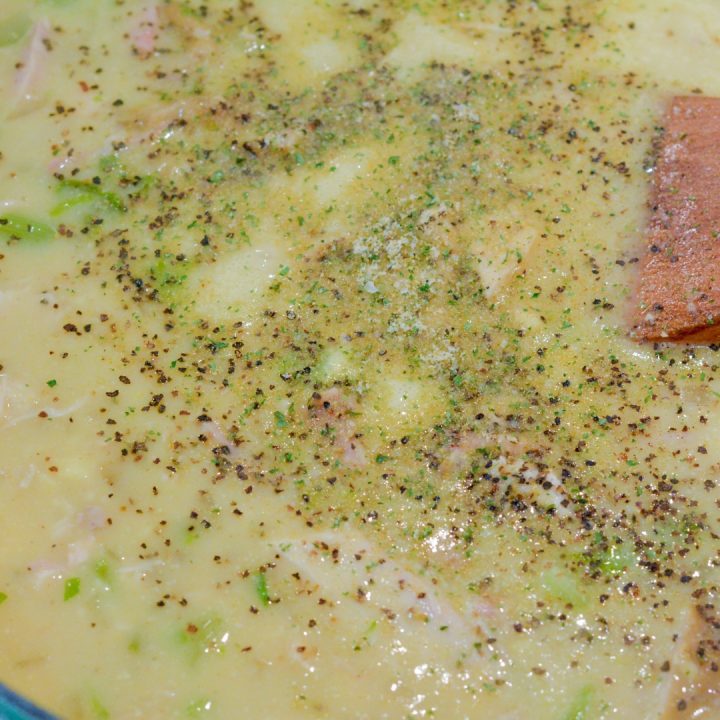 Then slowly stir in the chicken broth. Keep stirring to dissolve the cream of chicken soup before adding the second can. Stir to combine to form a watery sauce. Add the garlic pepper to your taste preference.