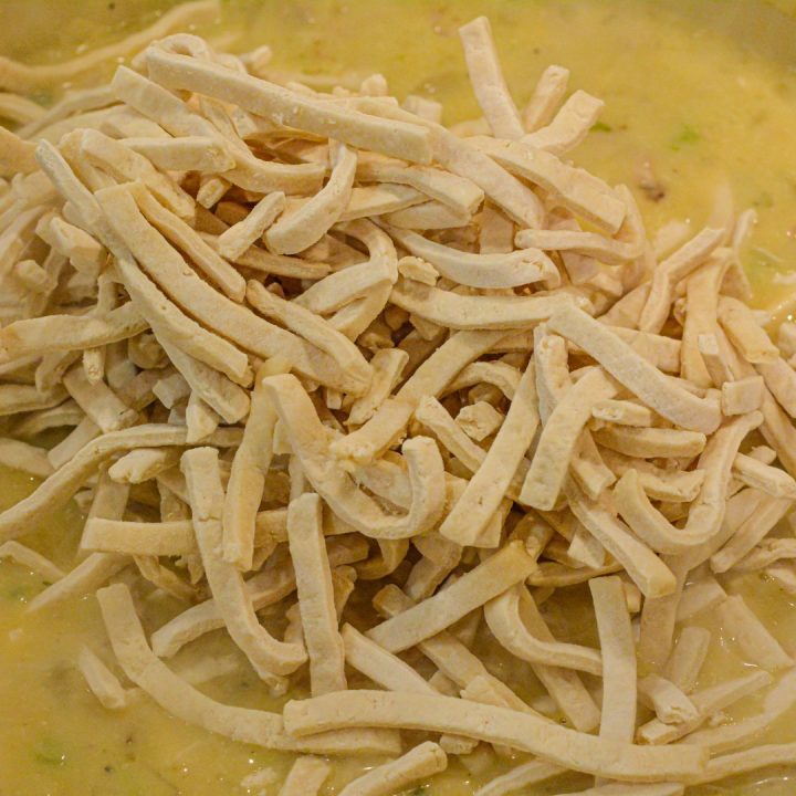 Finally, add the egg noodles to the pot once the mixture begins to boil. Stir to combine. Once it begins to boil again, reduce the heat and simmer for 20 minutes or until the noodles are cooked.