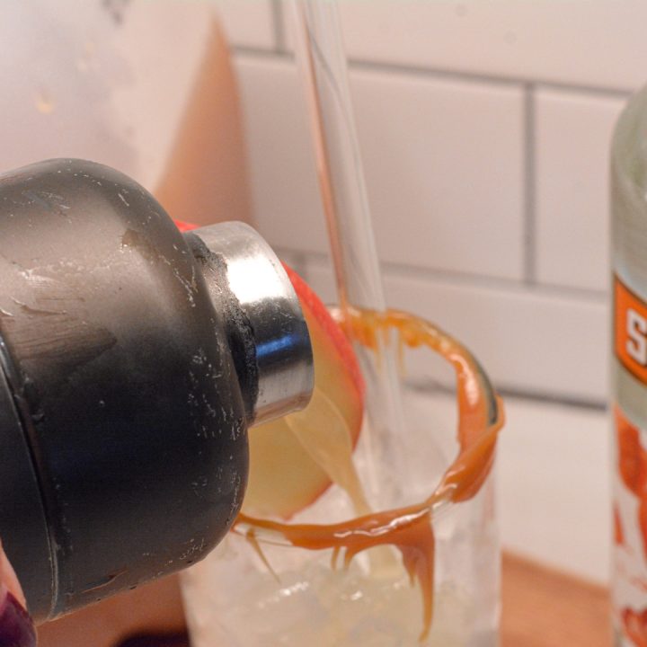 Pour the shaken caramel apple into the prepared collins glass. If your shaker doesn't have a strainer, pour through one for straining out any apple pulp.