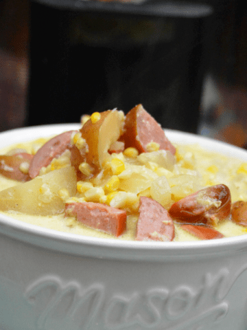 Add this simple corn chowder with smoked sausage to menu this week. This chowder is a cream based soup that slow cooks all day for an easy dinner for the family.