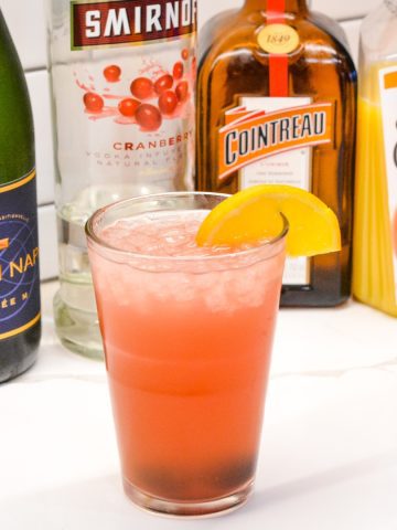The Cranberry Orange Champagne Cocktail is a fruity cocktail that champagne with vodka, orange liqueur, cranberry juice and orange juice.