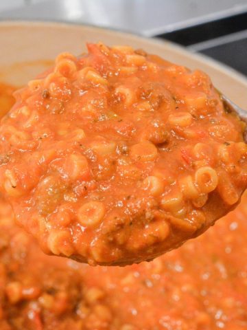 My version of homemade spaghettios uses tomato sauce, tender little pasta rings, bites of ground beef, cheese, and seasonings.