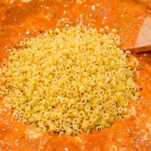 Finally, add the pasta rings and stir to combine, then reduce to a simmer and place the lid on the pot. Simmer for 15-20 minutes or until pasta is soft.