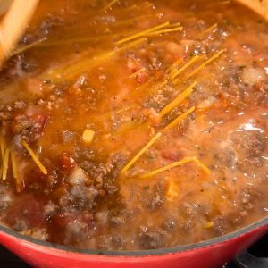 Bring to a boil. Cover the Dutch oven and let simmer for about 10 minutes. Stir gently several times during this ten minutes.
