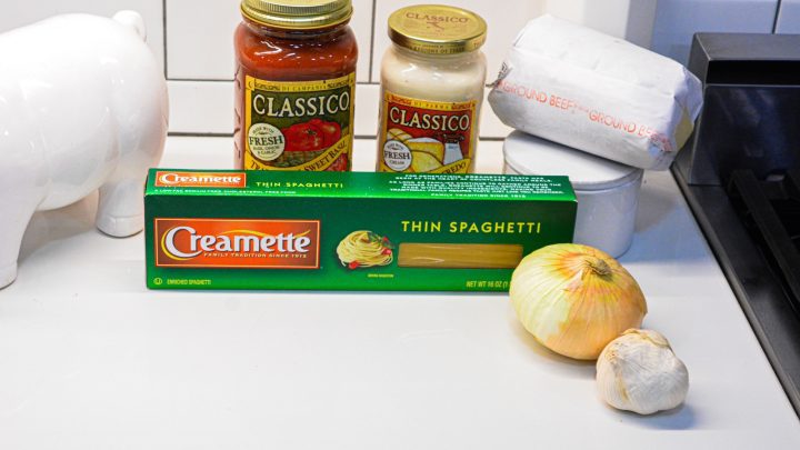 TikTok Spaghetti Ingreidnets - Marinara sauce, alfredo sauce, ground beef, spaghetti noodles, onions, and garlic