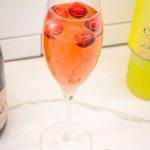 The Cranberry Limoncello Champagne Cocktail is a sparkling cocktail made with just cranberry juice, limoncello, and your favorite champagne or prosecco.