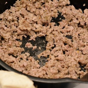 Brown the sausage and add two teaspoons of pizza seasoning if not using Italian sausage.