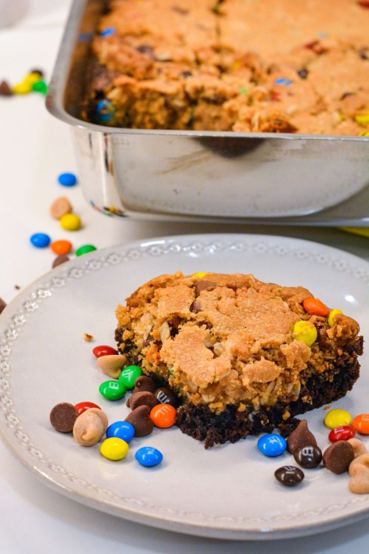 Fudgy brownies monster cookie bars combine a brownie mix with a peanut butter cookie dough mix with the addition of oatmeal, peanut butter, chocolate chips, m&m's and peanut butter chips.