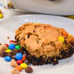 Fudgy brownies monster cookie bars combine a brownie mix with a peanut butter cookie dough mix with the addition of oatmeal, peanut butter, chocolate chips, m&m's and peanut butter chips.