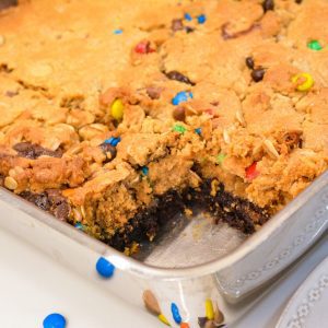 Cut the fudgy brownie monster cookie bars into large or small squares.