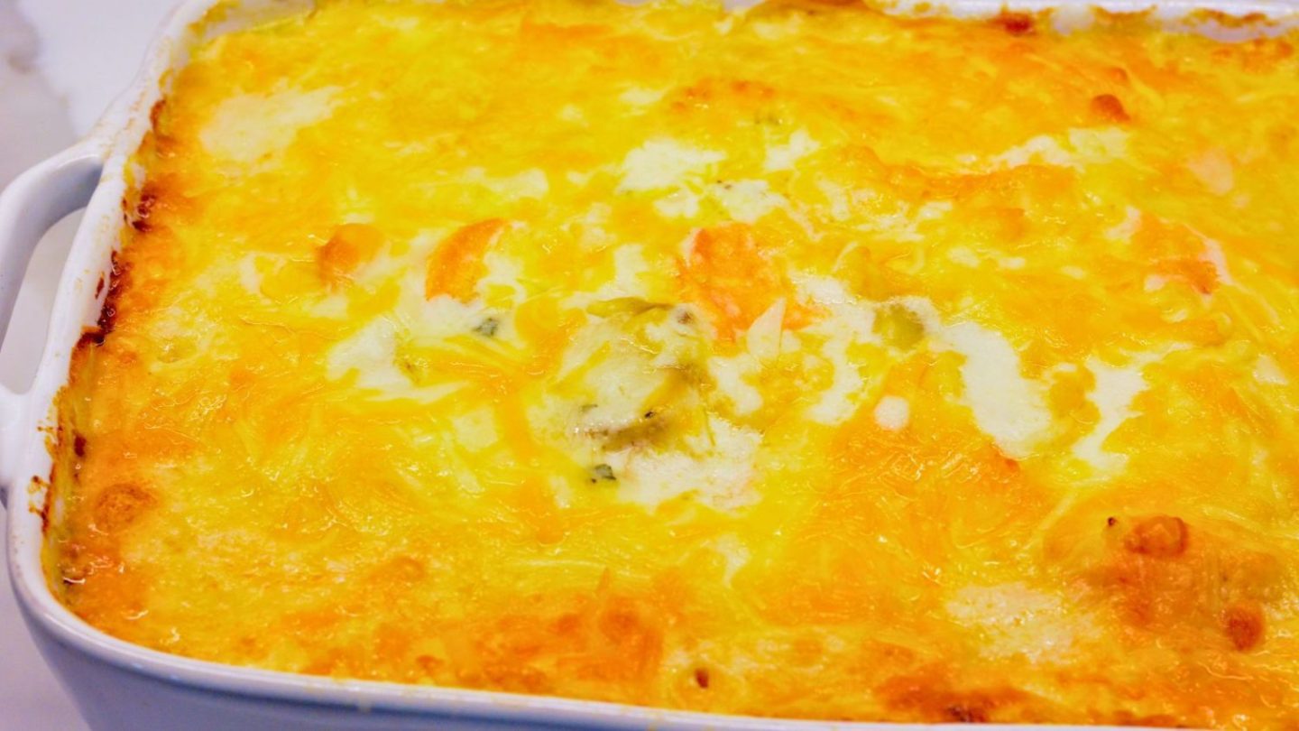 This cheese scalloped potatoes recipe uses both yellow potatoes and sweet potatoes along with onions, white sauce, and lots of cheese to make the ultimate cheesy au gratin potatoes.