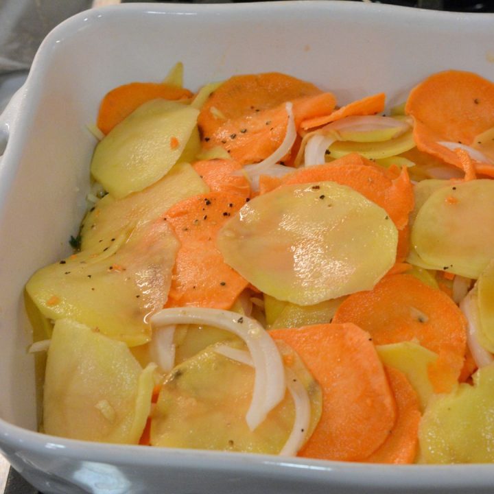 Follow up with a layer of ⅓ of the yellow potatoes, sweet potatoes, and onions. Then, follow up with 2 more layers of sauce, gruyere cheese, and potatoes. End with the sauce.