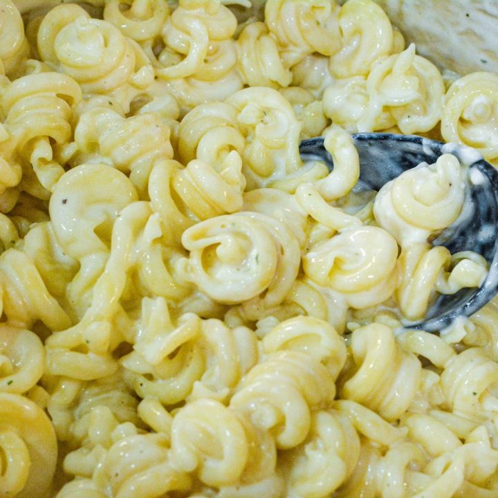 Add milk a quarter cup at a time until the consistency you like. Serve the white macaroni and cheese immediately after all cheese is melted. 