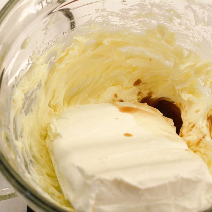 For the frosting, beat the cream cheese, softened butter, and vanilla in a mixing bowl.