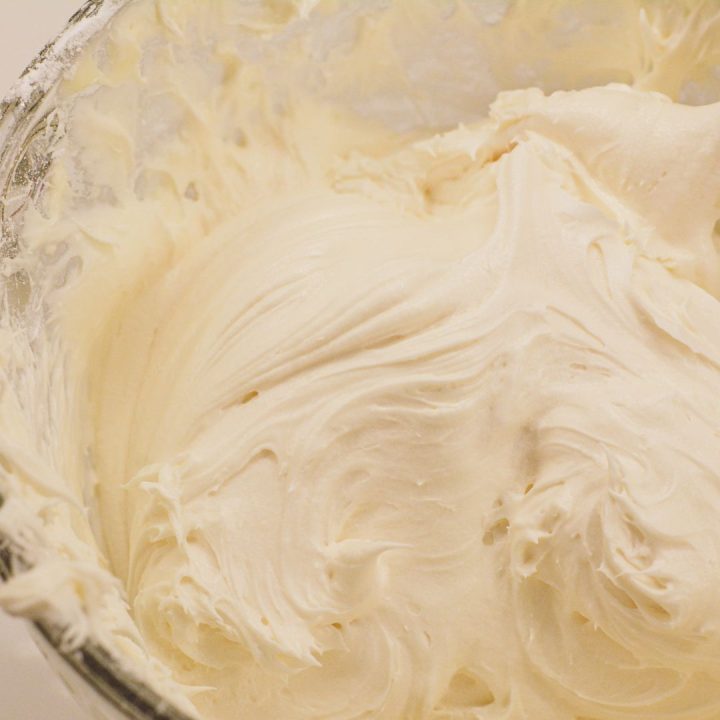 Slowly add the powdered sugar to the cream cheese mixture until the cream cheese icing reaches the desired thickness or consistency.