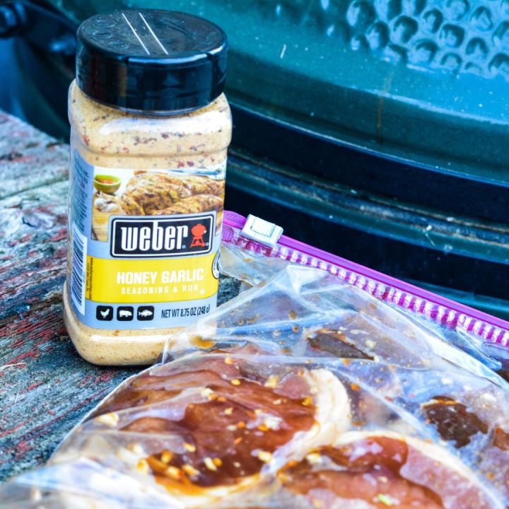 Preheat the grill to 375°F. Remove the pork chops from the marinade and season before placing on the grill.