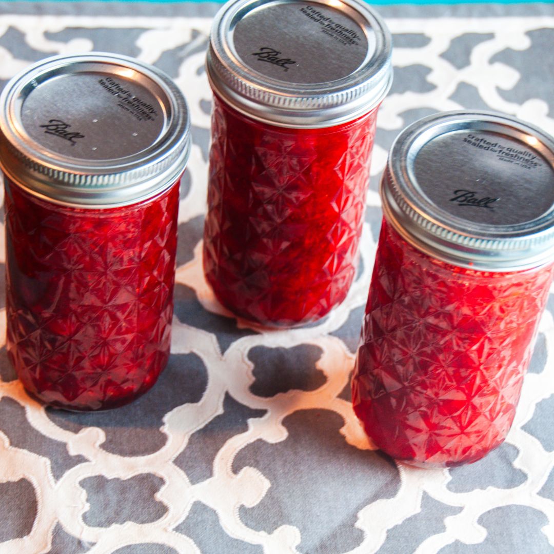 You can create a jar of homemade strawberry freezer jam that's bursting with flavor with strawberries, pectin, sugar, lemon juice, and water.