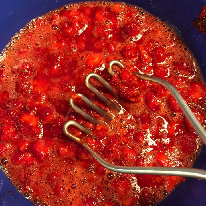 Dump the strawberries in a large bowl. You can mash the strawberries with a potato masher for a smoother jam or leave them chunkier for more texture. 