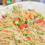 Cold Spaghetti Pasta Salad is a garden vegetable heaven in this delicious Italian pasta salad filled with cucumbers, celery, carrots, onions, peppers, olives, tomatoes, and parmesan cheese.