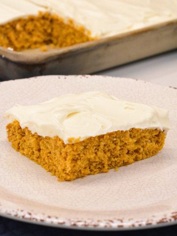 Moist, spiced, and topped with the creamiest frosting, these cake mix Pumpkin Bars with cream cheese frosting are a must-try fall dessert! Made with pumpkin puree and a box of spice cake mix, they&rsquo;re simple to whip up and perfect for any gathering. Baked in a 10x15-inch pan for the ideal shareable treat.