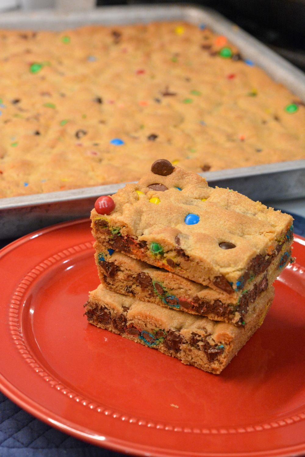 These M&M and Chocolate Chip Cookie Bars with Vanilla Pudding are soft, chewy, and loaded with chocolatey goodness! The secret? Melted butter + Crisco and a box of vanilla pudding mix for that perfect gooey texture.