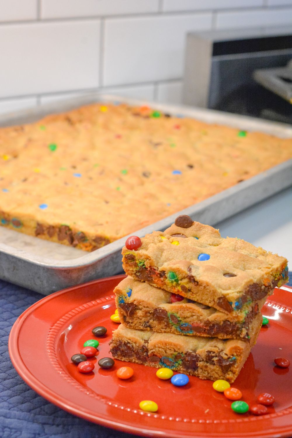 These M&M and Chocolate Chip Cookie Bars with Vanilla Pudding are soft, chewy, and loaded with chocolatey goodness! The secret? Melted butter + Crisco and a box of vanilla pudding mix for that perfect gooey texture.