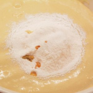 Pour the pudding and vanilla into the wet ingredients. Mix until thoroughly mixed and no longer gritty looking.
