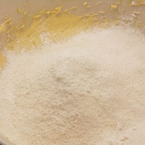 In a separate bowl, whisk together the flour, vanilla pudding mix, baking soda, and salt. Gradually add the dry ingredients to the wet mixture, stirring just until everything is combined.