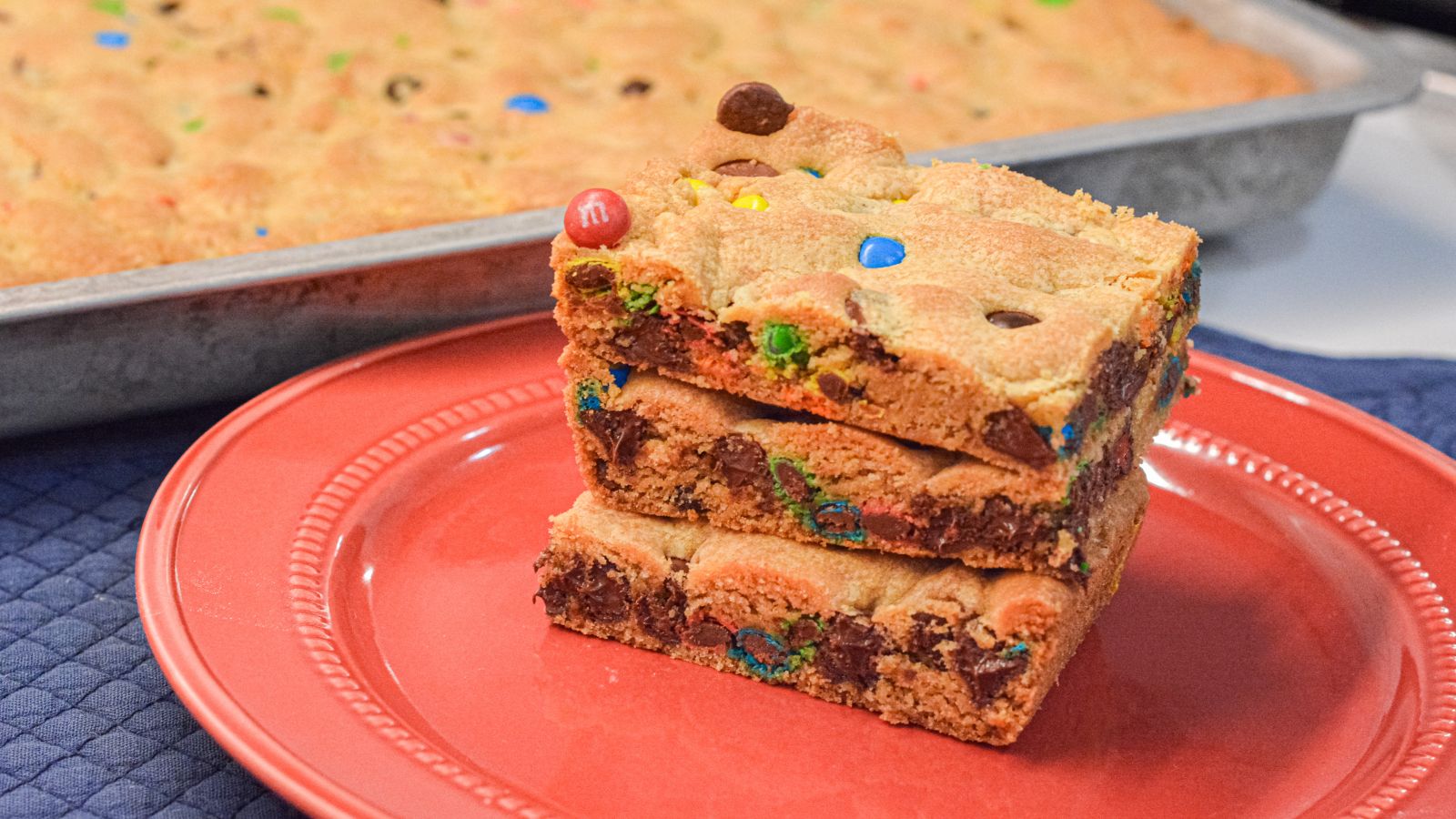 These M&M and Chocolate Chip Cookie Bars with Vanilla Pudding are soft, chewy, and loaded with chocolatey goodness! The secret? Melted butter + Crisco and a box of vanilla pudding mix for that perfect gooey texture.