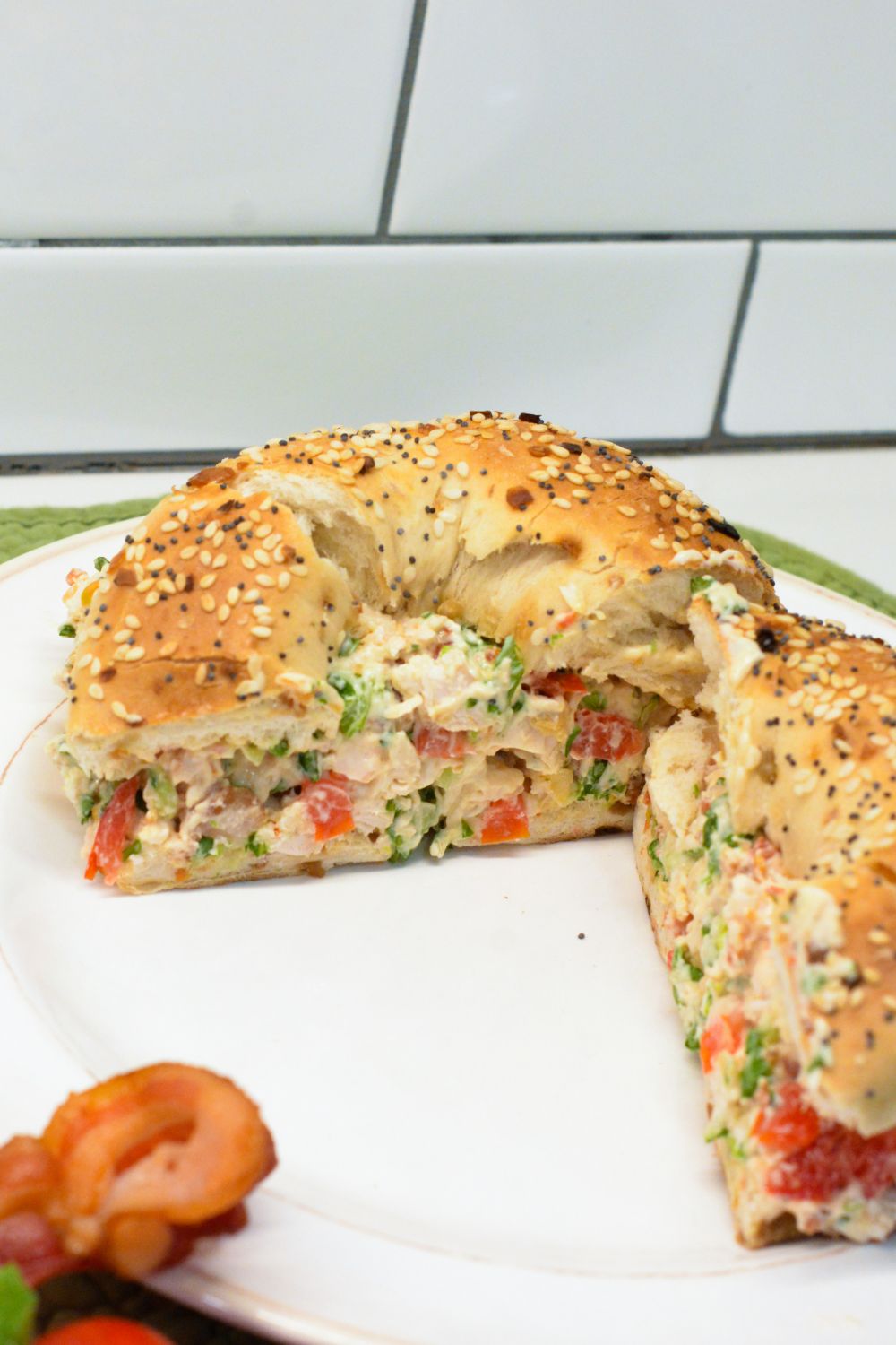 These chopped chicken bacon ranch salad bagels are a quick, no-cook lunch made with rotisserie chicken, crispy bacon, tomatoes, lettuce, and ranch cream cheese. Ready in 15 minutes!
