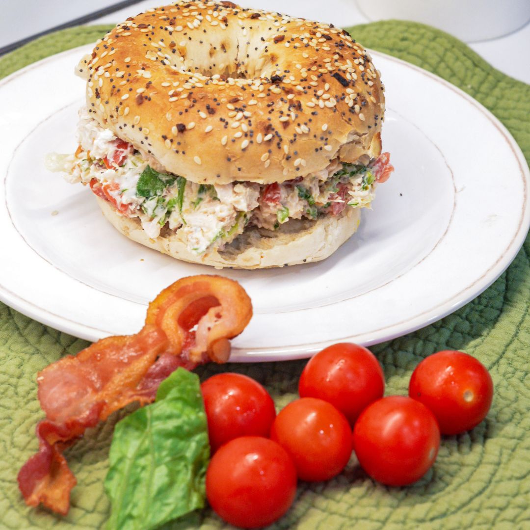 These chopped chicken bacon ranch salad bagels are a quick, no-cook lunch made with rotisserie chicken, crispy bacon, tomatoes, lettuce, and ranch cream cheese. Ready in 15 minutes!
