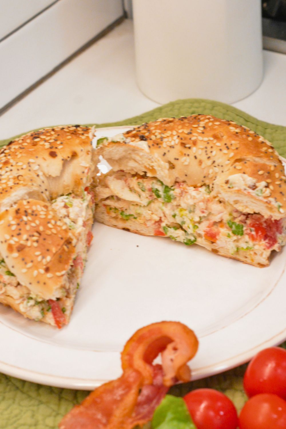 These chopped chicken bacon ranch salad bagels are a quick, no-cook lunch made with rotisserie chicken, crispy bacon, tomatoes, lettuce, and ranch cream cheese. Ready in 15 minutes!