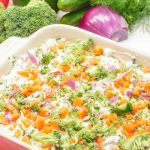 This easy veggie pizza dip is a creamy, no-bake appetizer made with cream cheese, ranch, cheddar cheese, and fresh chopped veggies. Perfect for parties, potlucks, and game day!