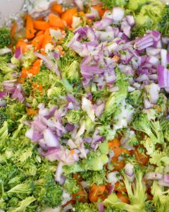 Mix in the chopped veggies and cheese. Transfer the mixture to a serving dish or shallow pie plate and spread it out evenly.