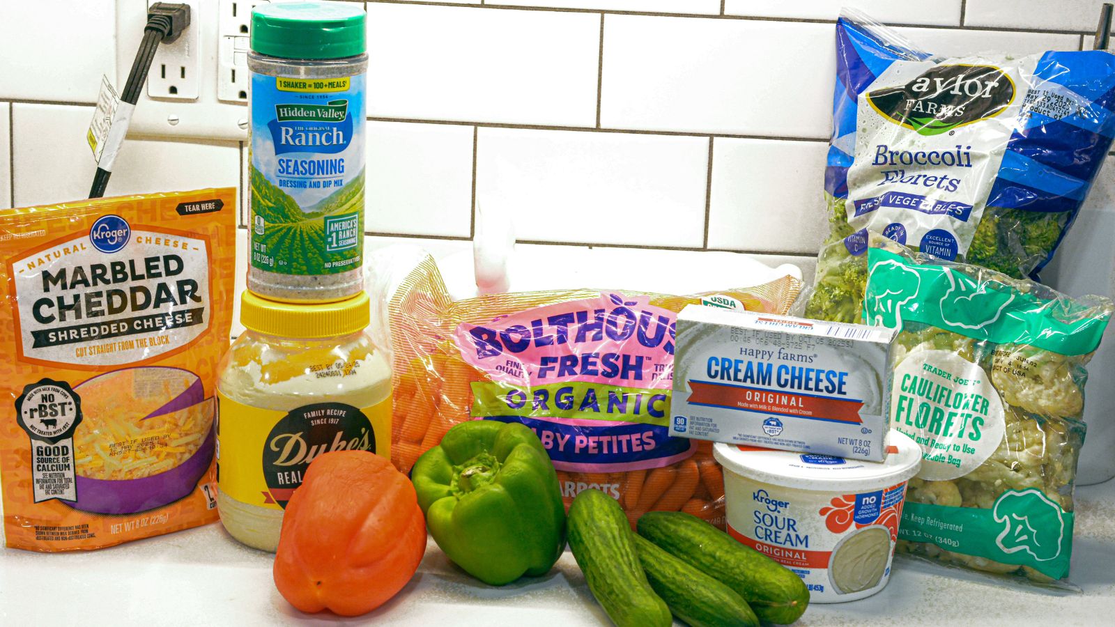 8 ounces cream cheese, softened
1 cup sour cream
2 tablespoons ranch dressing
¼ cup fresh dill, chopped
¼ cup fresh chives, chopped
1 cup shredded cheddar cheese
2 cups finely chopped raw veggies (use any combo of carrots, broccoli, cauliflower, cucumbers, red onion, bell peppers)
