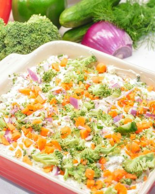 This easy veggie pizza dip is a no-bake party favorite loaded with cream cheese, ranch, herbs, cheddar cheese, and tons of chopped fresh veggies!