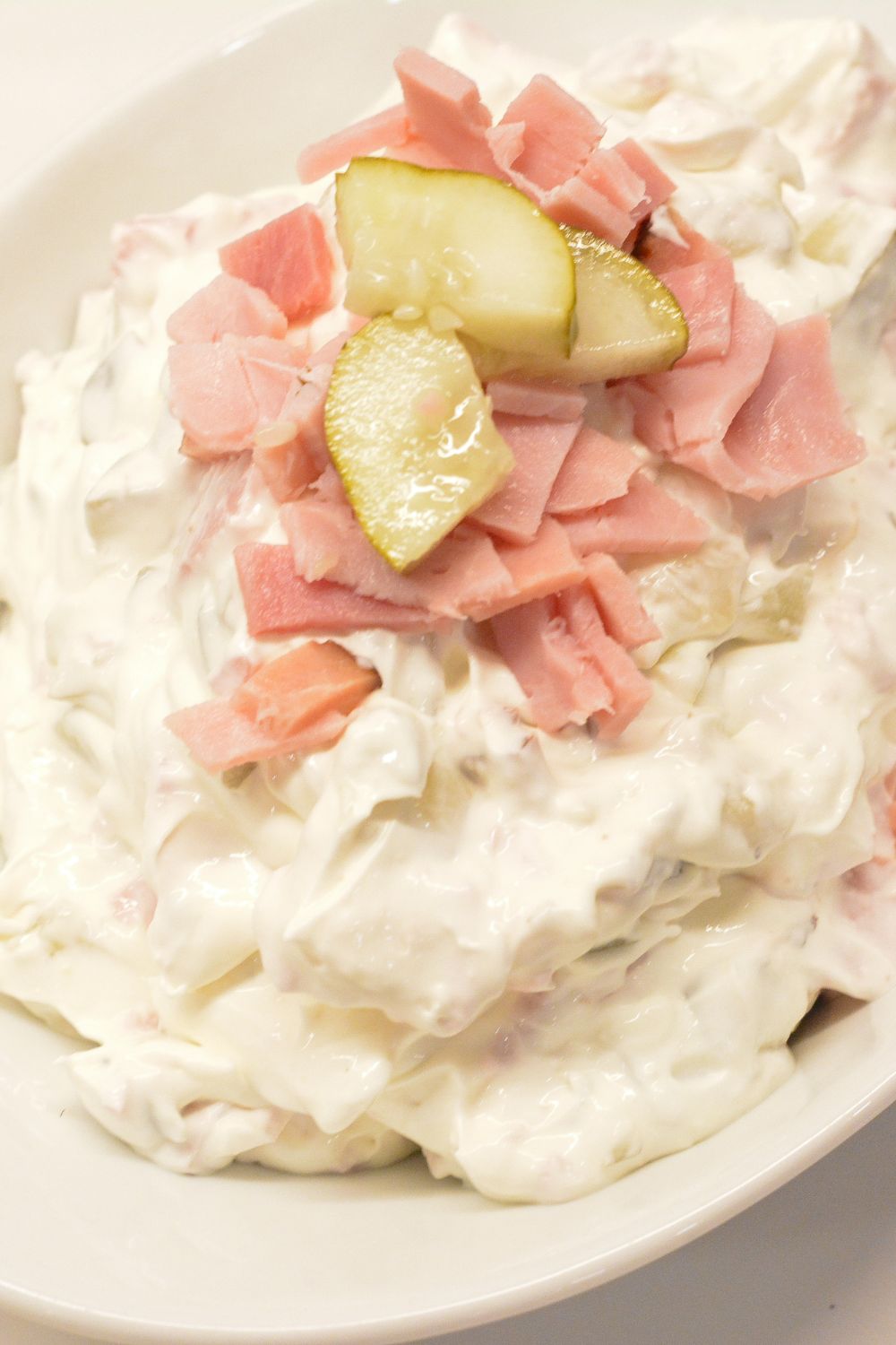 This creamy pickle wrap dip made with deli ham, cream cheese, and dill pickles is the ultimate party appetizer. All the flavor of classic pickle wraps without the work!