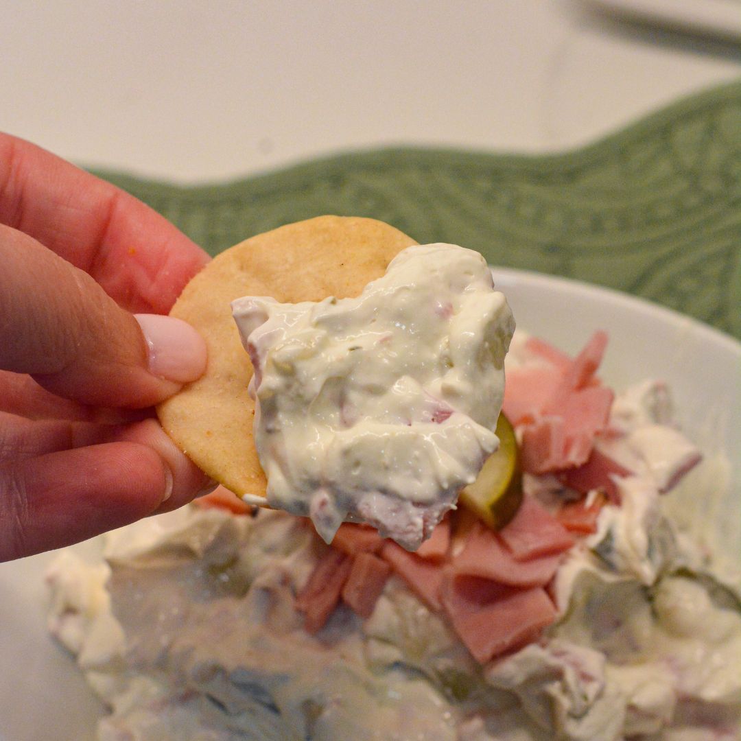 This creamy pickle wrap dip made with deli ham, cream cheese, and dill pickles is the ultimate party appetizer. All the flavor of classic pickle wraps without the work!