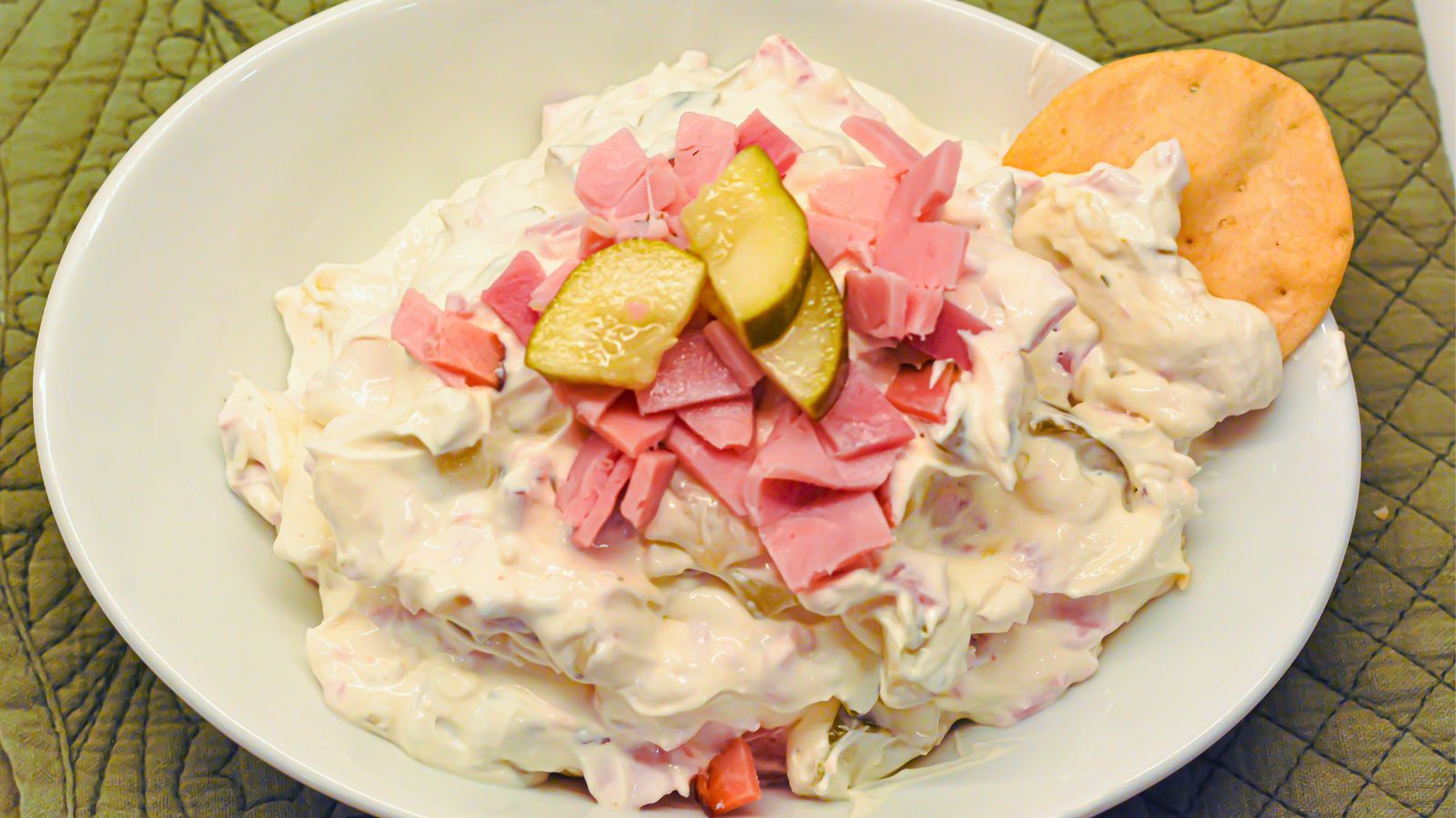 Whether you're hosting a game day get-together, planning a holiday spread, or just craving a savory snack, this Pickle Wrap Dip with deli ham is guaranteed to be a hit. It delivers all the nostalgic flavors of traditional ham and pickle roll-ups in a quick, scoopable form that’s perfect for sharing.